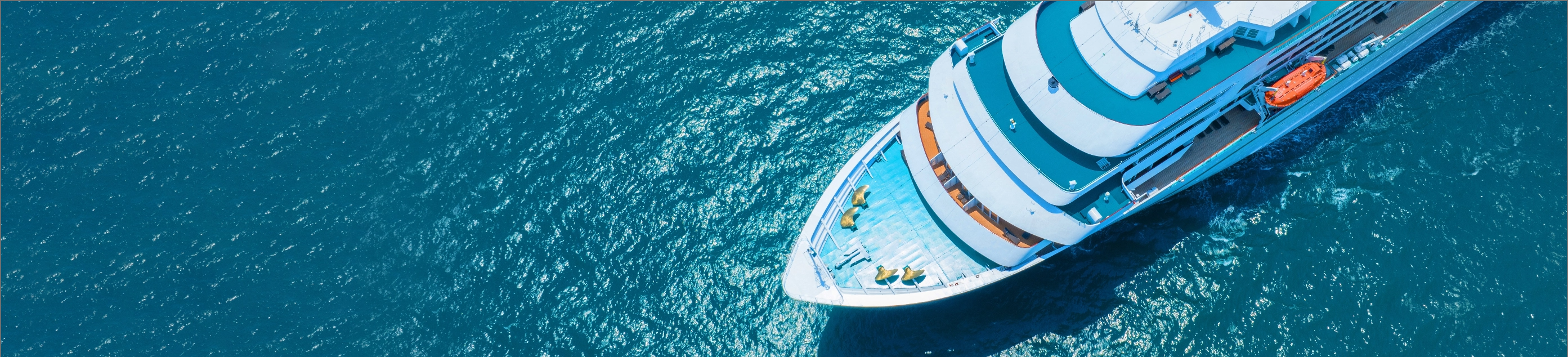 Cruise ship on turquoise ocean - aerial view